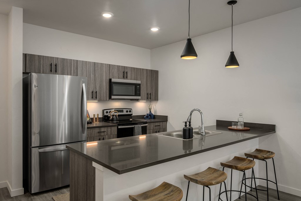 a kitchen with a large island and a stainless steel refrigerator at Crosshatch, Idaho, 83714