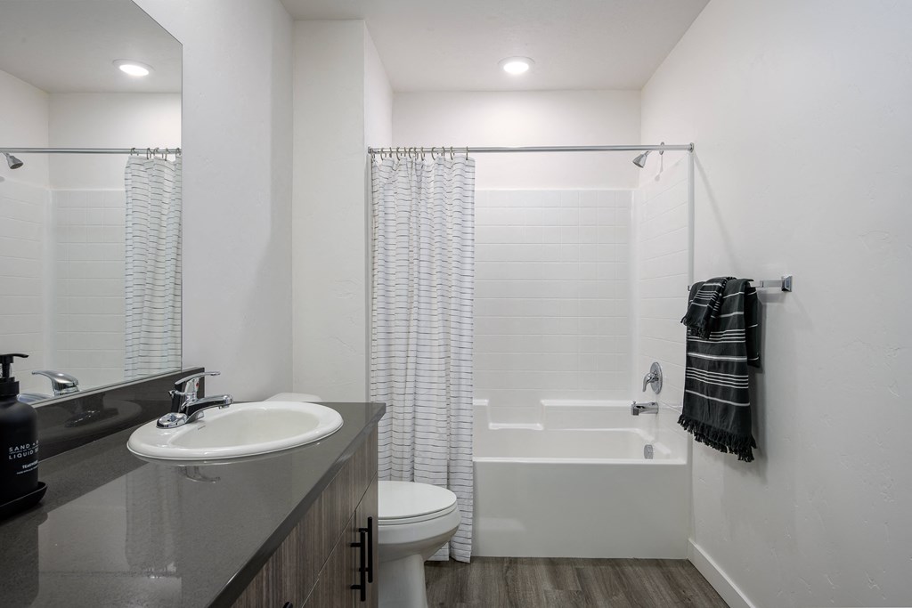 a bathroom with a sink toilet and shower at Crosshatch, Garden City, ID