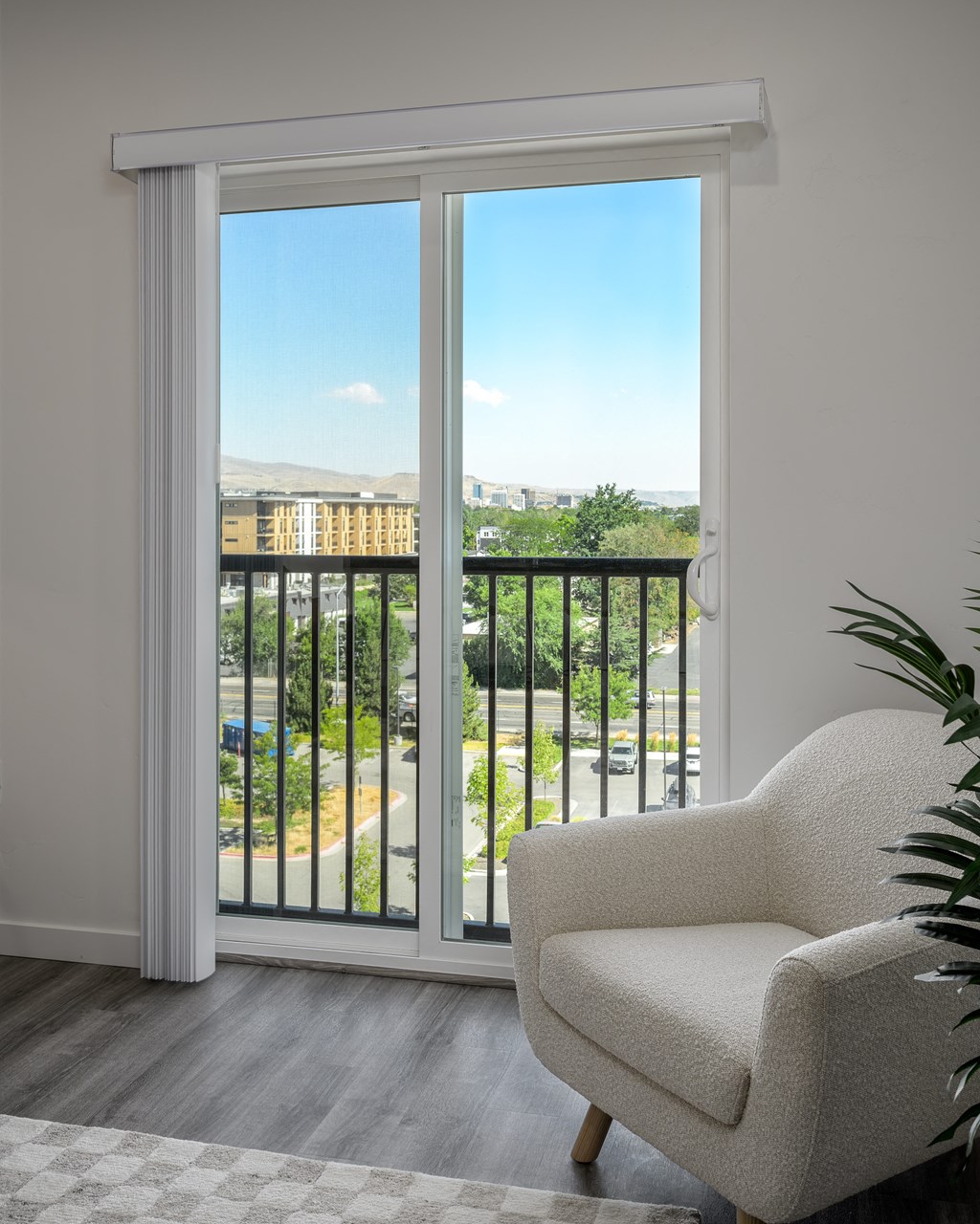 a room with a balcony and a chair and a window at Crosshatch, Garden City, ID