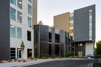 a group of modern buildings with a street in front of them