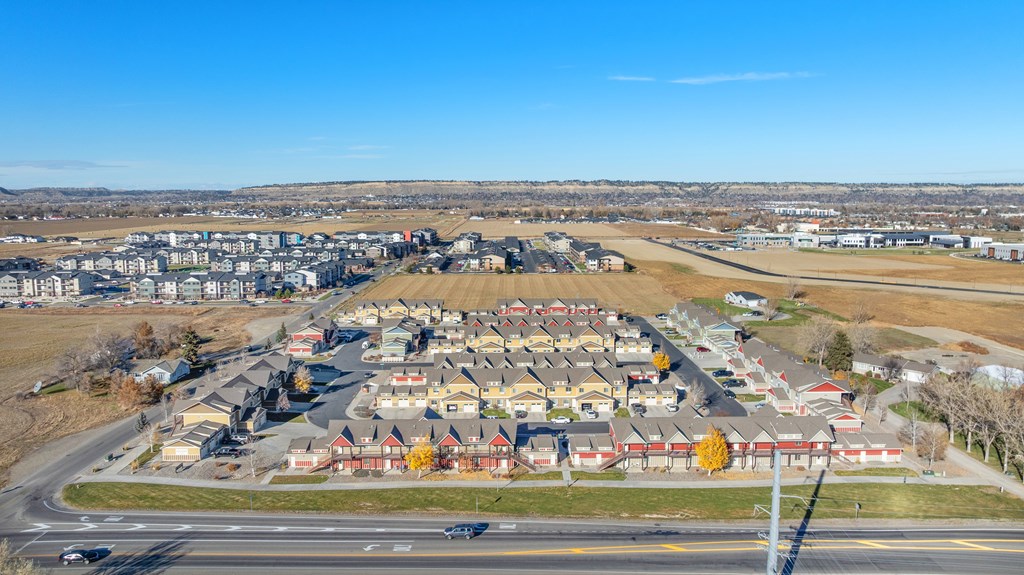 A suburban neighborhood with houses and a road.