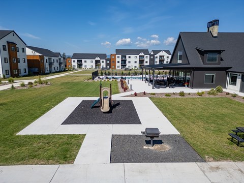 A black and white checkered pattern is in the middle of a grassy area at Silverbrook Apartments, Montana, 59901