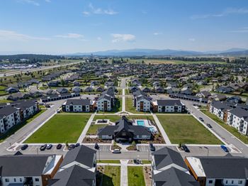 A bird's eye view of a residential area with houses and a park. at Silverbrook Apartments, Montana