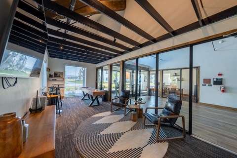 A room with a black and white rug and wooden floors. at Silverbrook Apartments, Montana