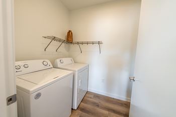 A laundry room with a washer and dryer. at Silverbrook Apartments, Kalispell, MT, 59901