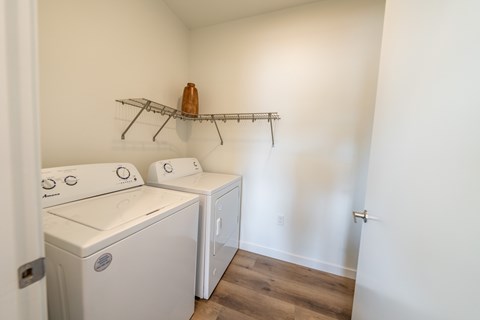 A laundry room with a washer and dryer. at Silverbrook Apartments, Kalispell, MT