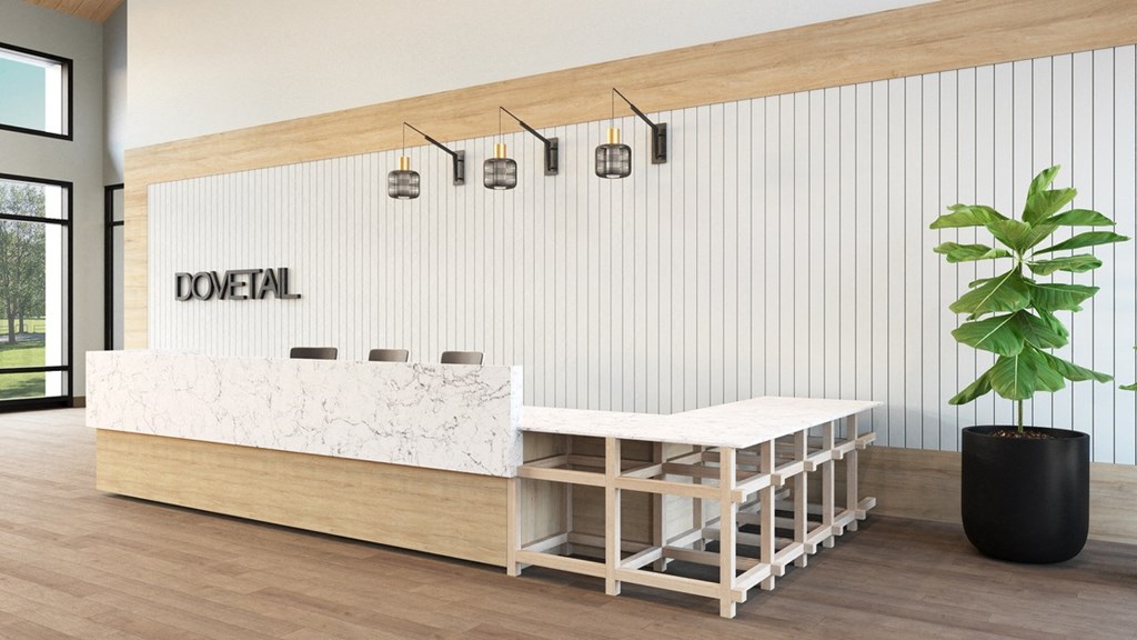 a mockup of a reception desk with a marble countertop and a plant in a pot
