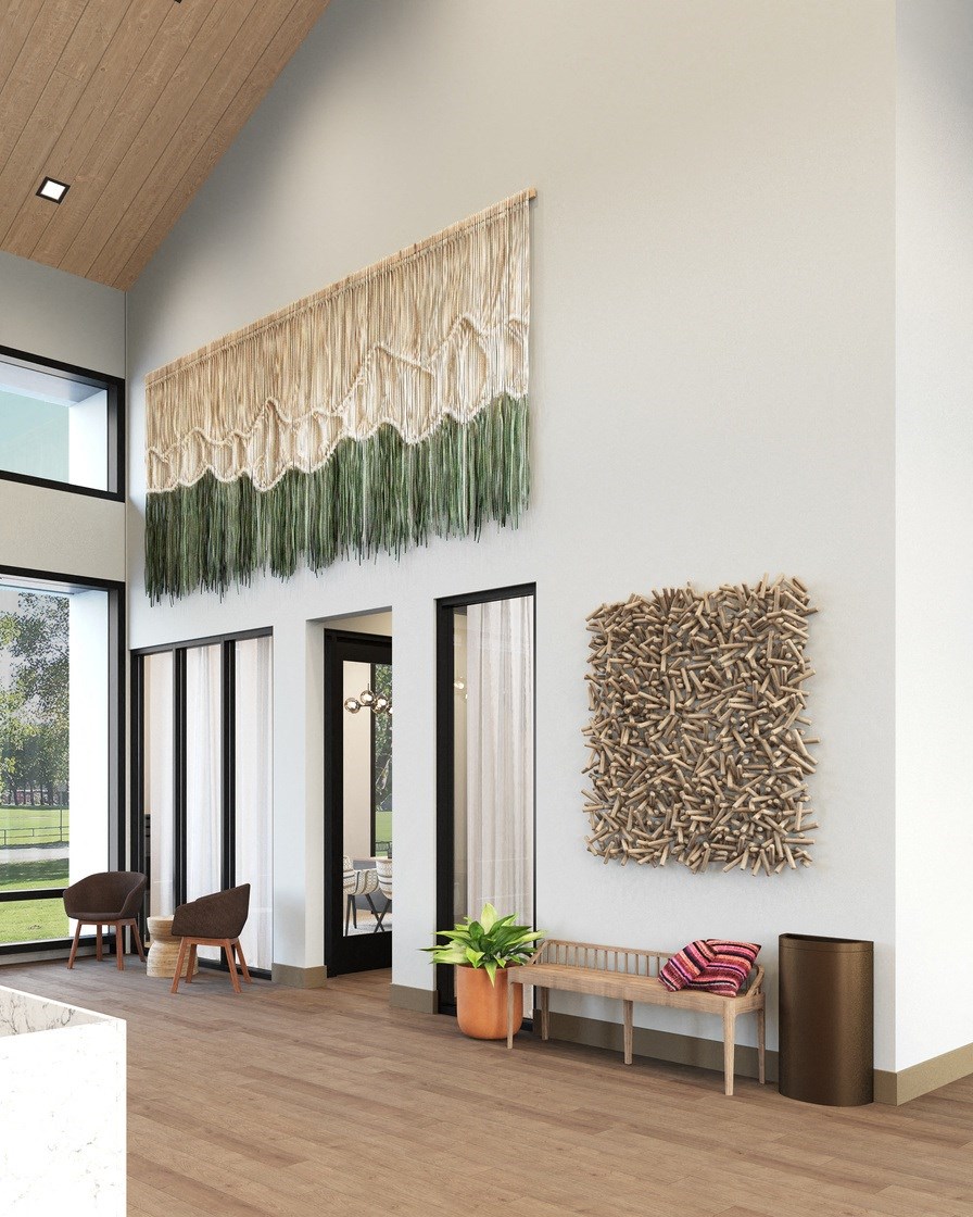 a living room with two pieces of art on the wall