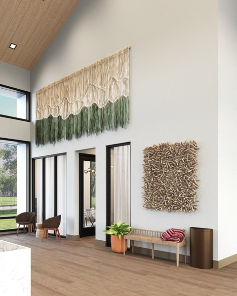 a living room with two pieces of art on the wall