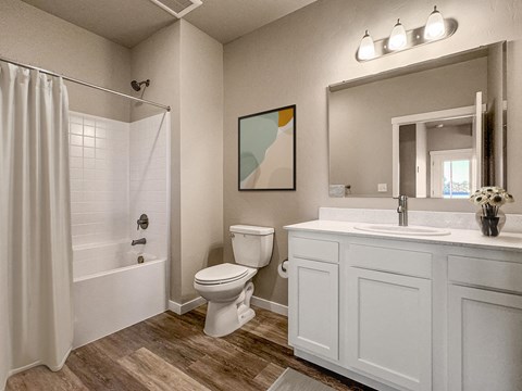 a white bathroom with a shower toilet and sink at Southside Townhomes, Nampa, 83686