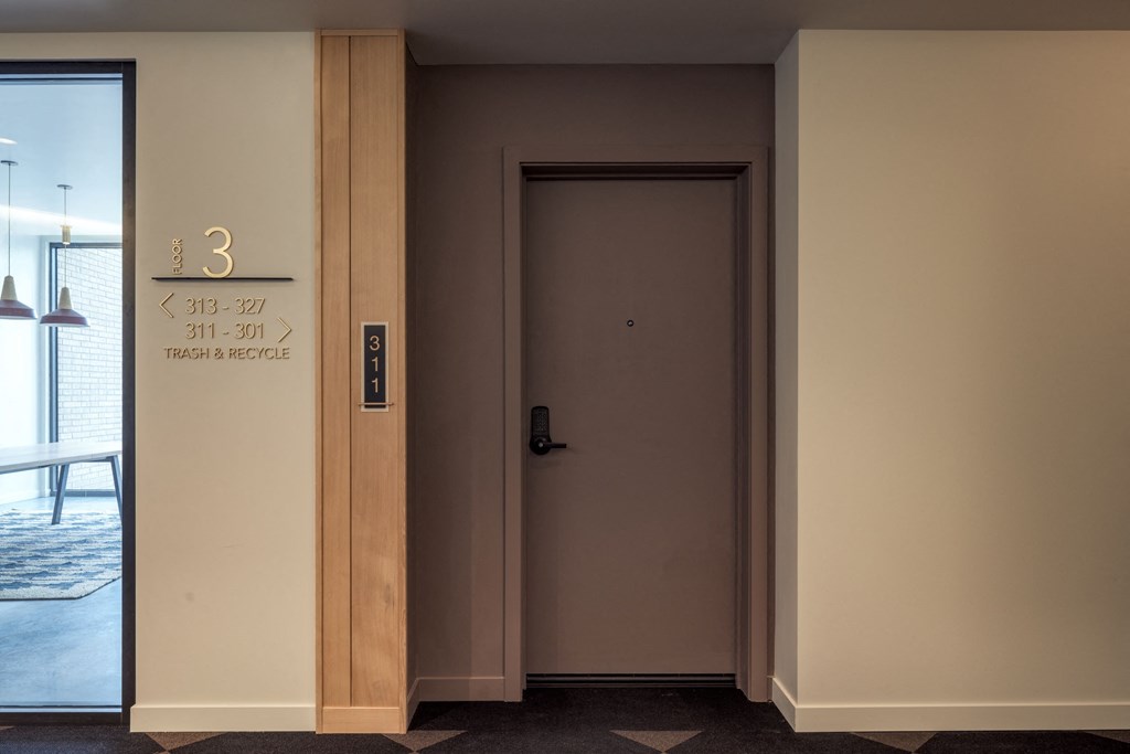 the door to the room with the room number on the wall