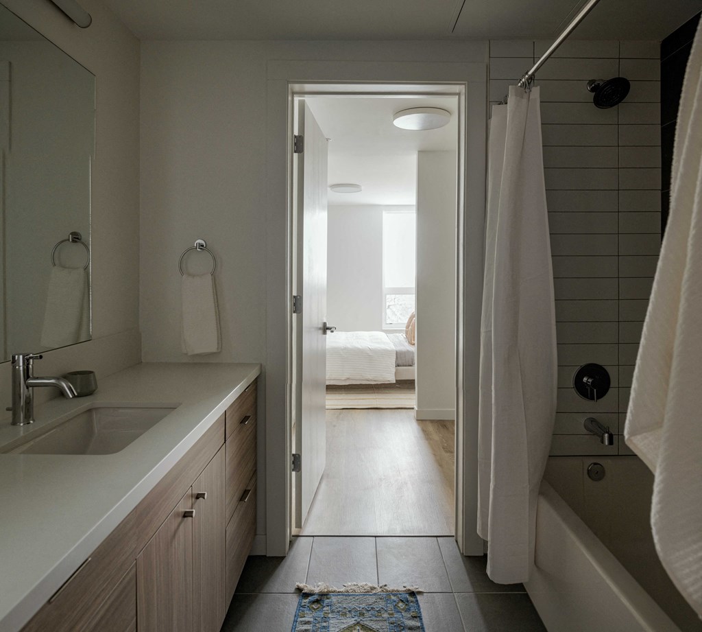 a small bathroom with a sink and a bathtub