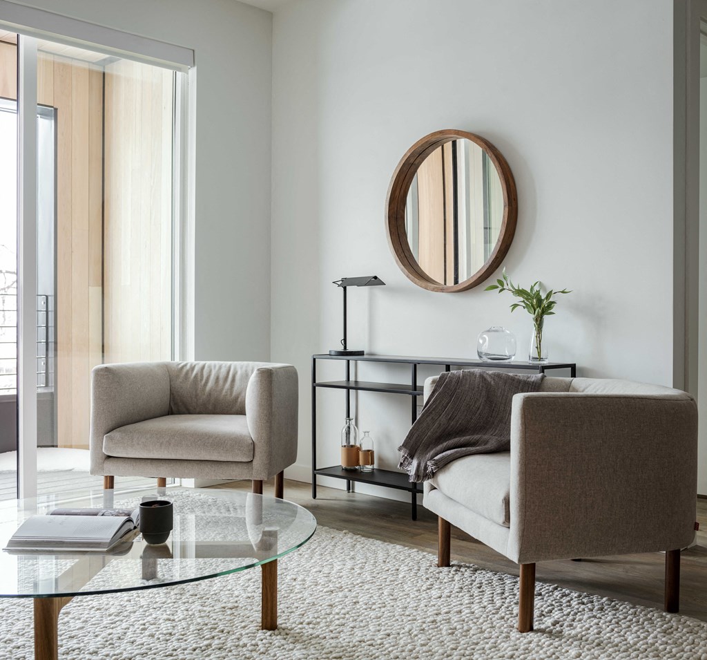 a living room with two chairs and a coffee table