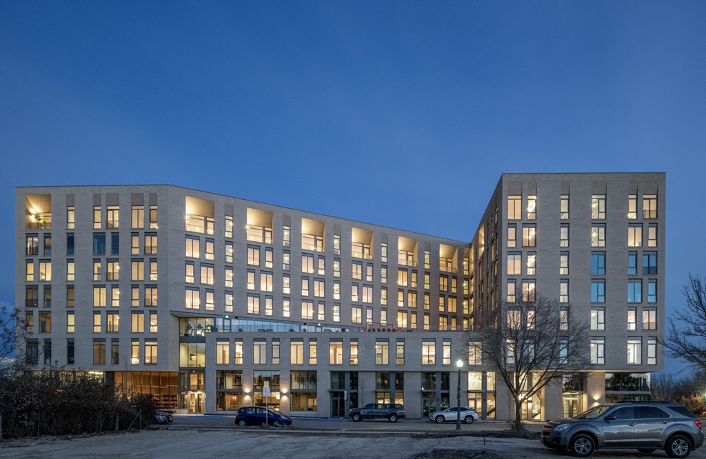 the exterior of a large building at night