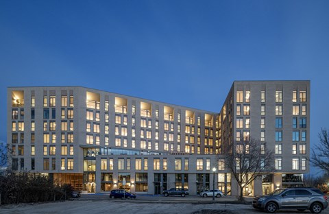 the exterior of a large building at night
