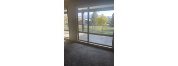 a room with a large window with a view of a park at Ashlyn Place, Missoula, 59801