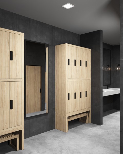 a bathroom with wooden cabinets and a mirror
