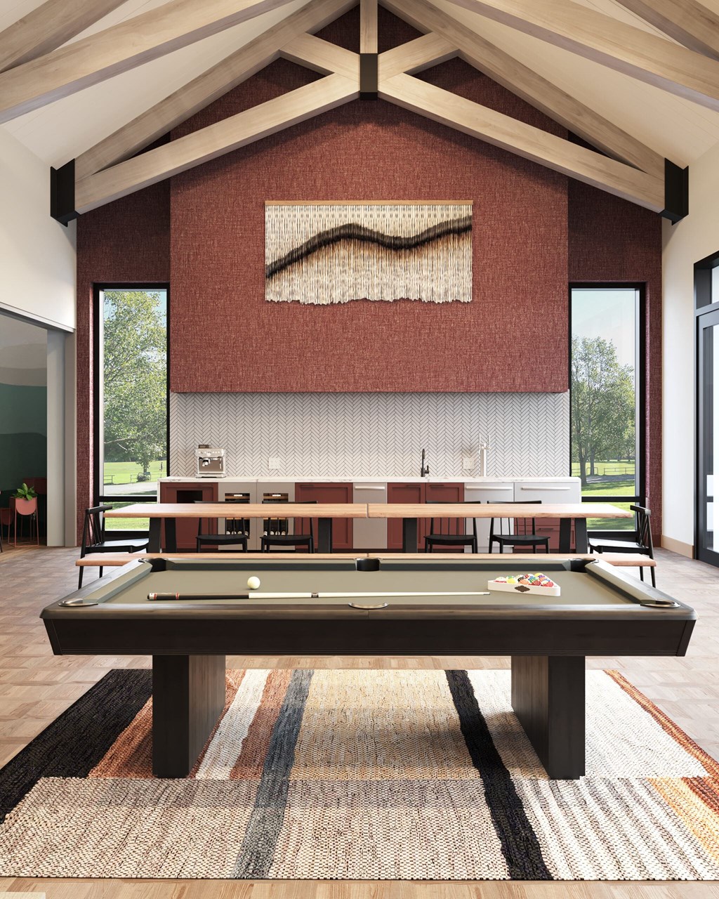 a game room with a pool table and ping pong table