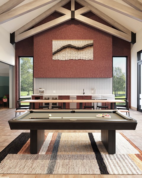 a game room with a pool table and ping pong table