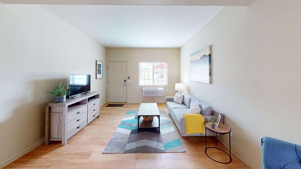 a living room with a couch and a tv