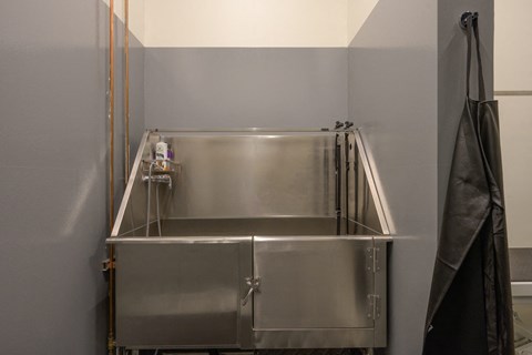 a stainless steel kitchen with a sink and a refrigerator at The Lucy Boise Apartments, Boise