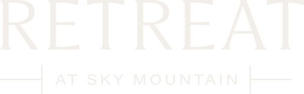 The image is a logo for a retreat at Sky Mountain.