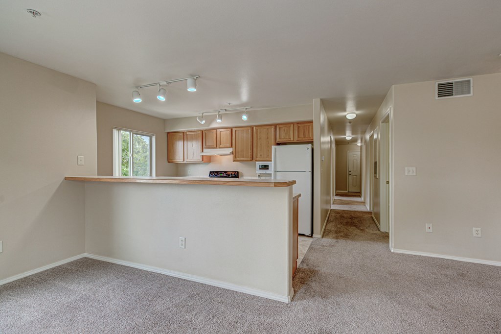 Kitchen with appliances and cabinets at River Walk Apartments, Boise, Idaho