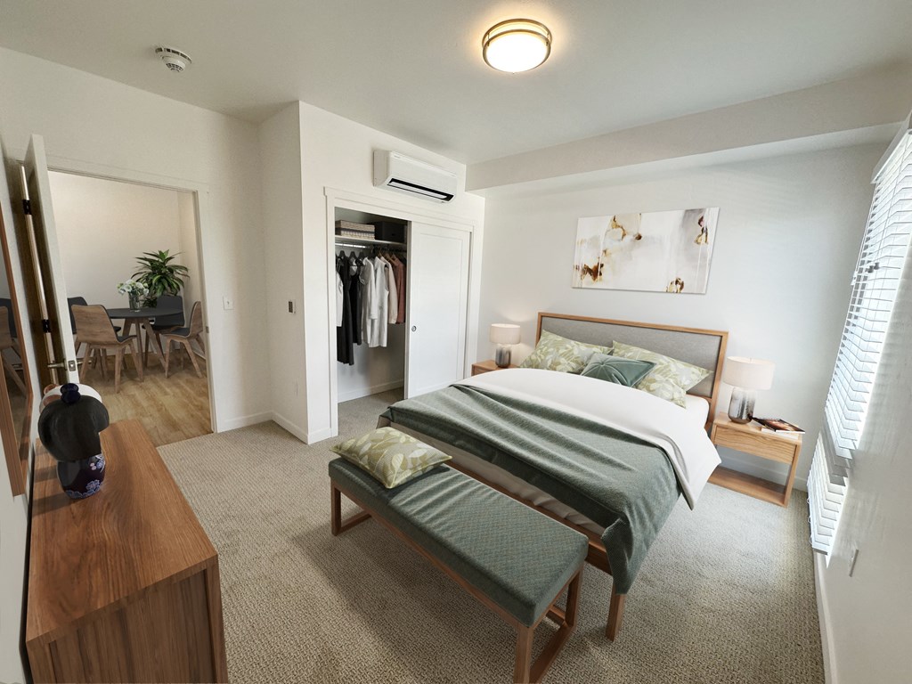 a bedroom with a bed and a dresser and a closet