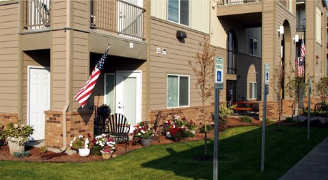 an flag in front of an apartment building