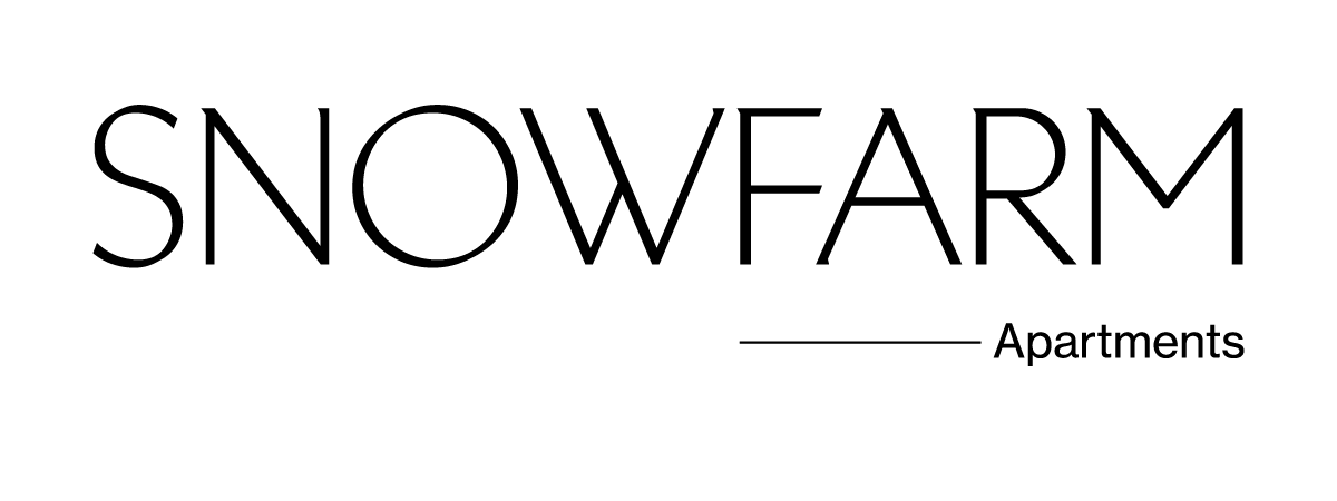 The image displays the name "SNOWFARM" in large letters, followed by a line and the word "Apartments" beneath it.