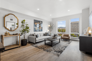 A living room with a grey sofa and a wooden coffee table.
