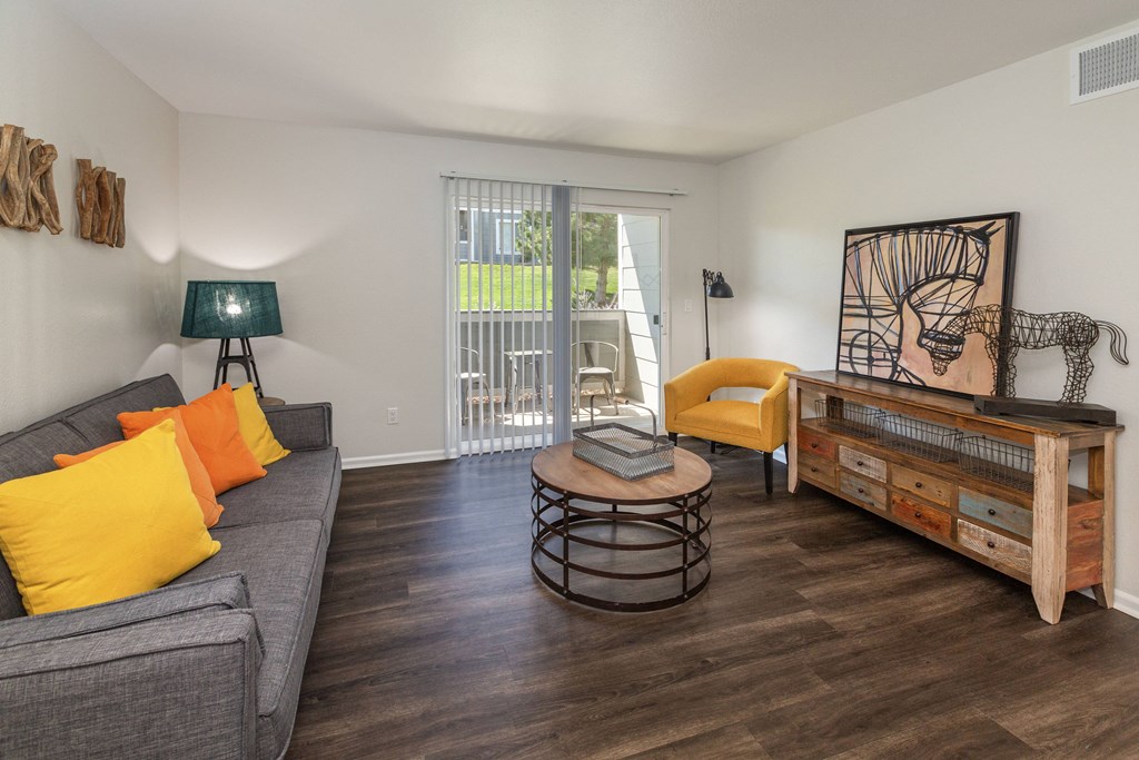 Living Area With Balcony at The Village at Westmeadow, Colorado Springs