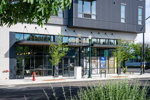 A modern building with a glass entrance and a sign that reads "North End".
