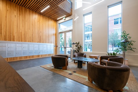 A room with a wooden wall and a whiteboard on the left side.