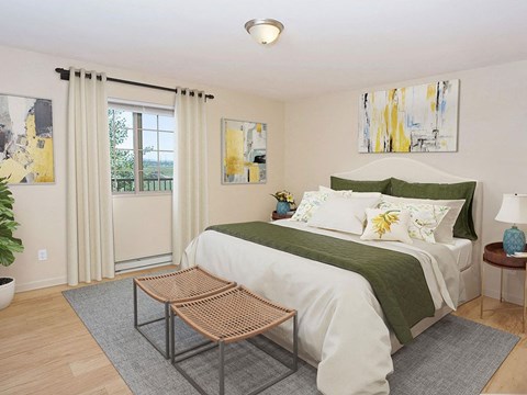 a bedroom with a bed and a window