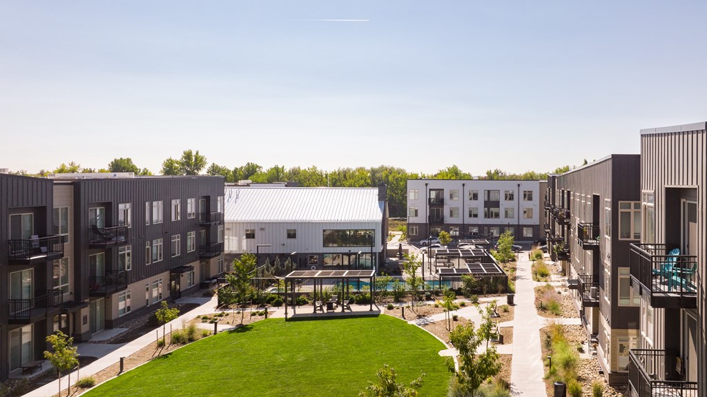 an aerial view of the courtyard of an apartment complex