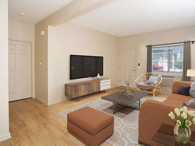Living Room With TV at King West One Apartments in Billings, 59106