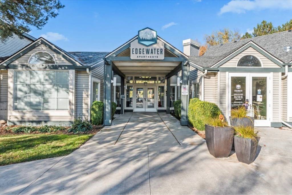 The entrance to a building with the sign "EDGEWATER" above it.