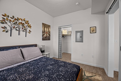 A bedroom with a bed and a painting at Majestic Drive, Montana