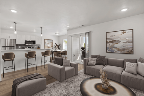 A modern living room with a grey sofa set and a coffee table.