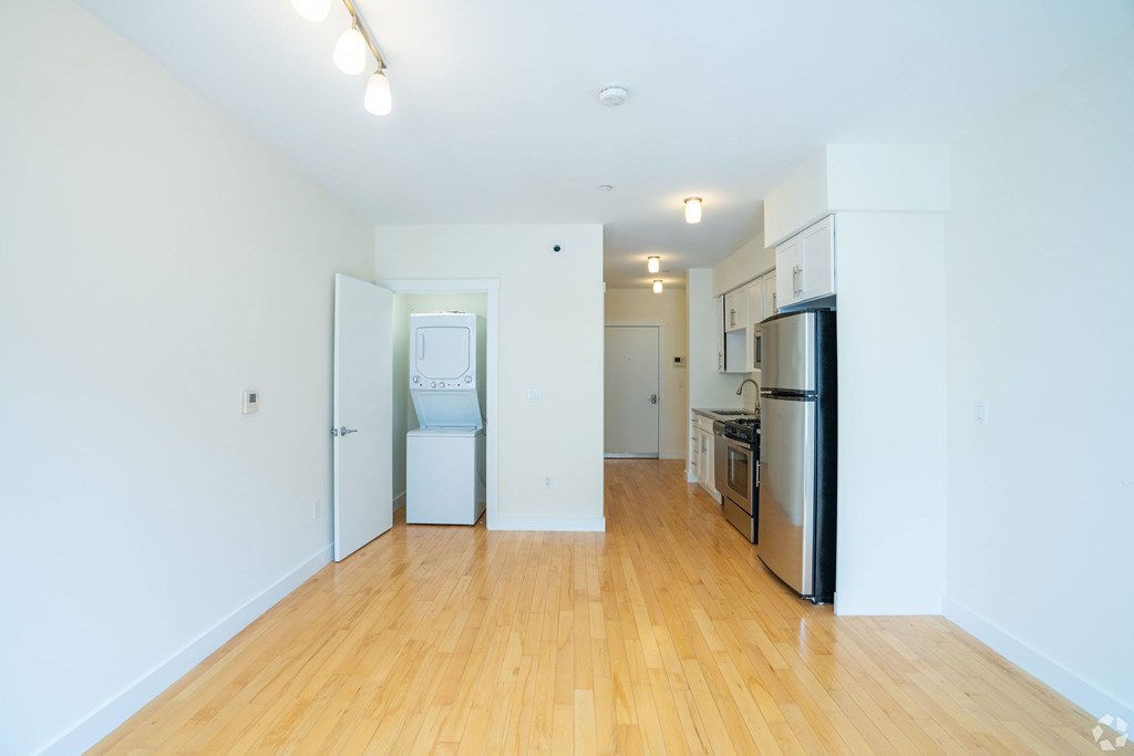 A kitchen with a refrigerator, oven, and sink. at 603 Concord Apartments, Cambridge, MA