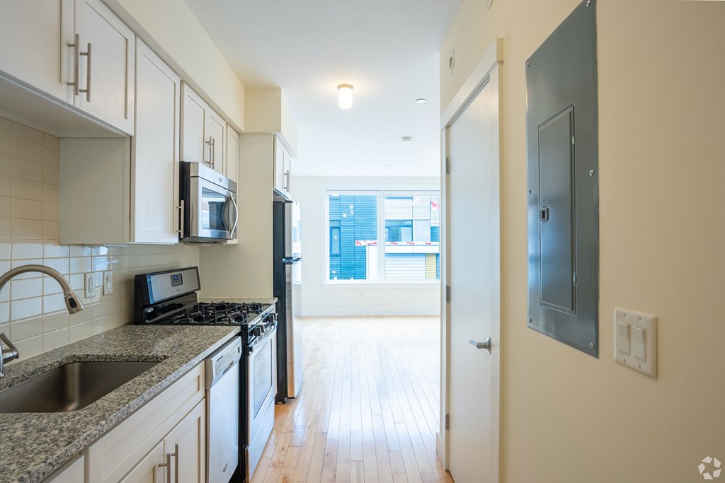 A kitchen with a sink, microwave, and oven. at 603 Concord Apartments, Cambridge, MA