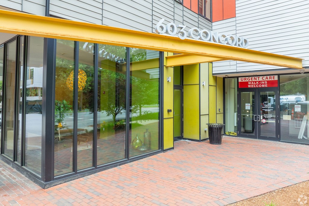 The front of a building with a red sign that says  at 603 Concord Apartments, Cambridge, Massachusetts