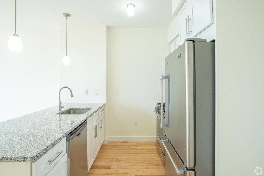 A kitchen with a granite countertop and stainless steel appliances. at 603 Concord Apartments, Massachusetts, 02138
