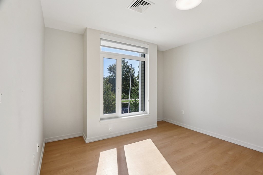 Bedroom with Large windows at Park77 Apartments, Cambridge, Massachusetts