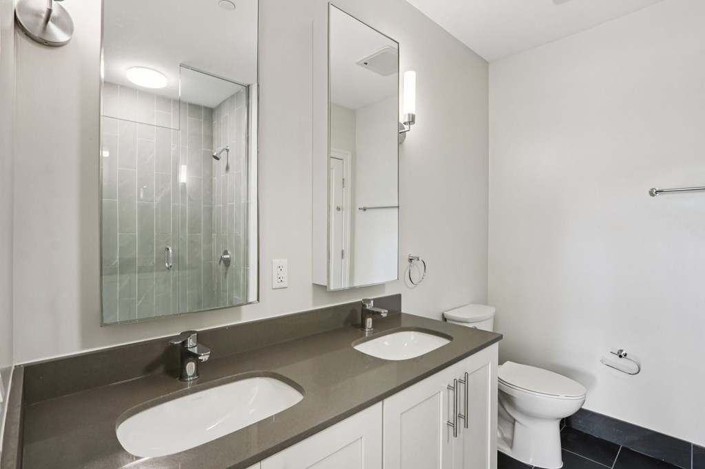 Bathroom with a toilet and sink at Park77 Apartments, Cambridge, MA