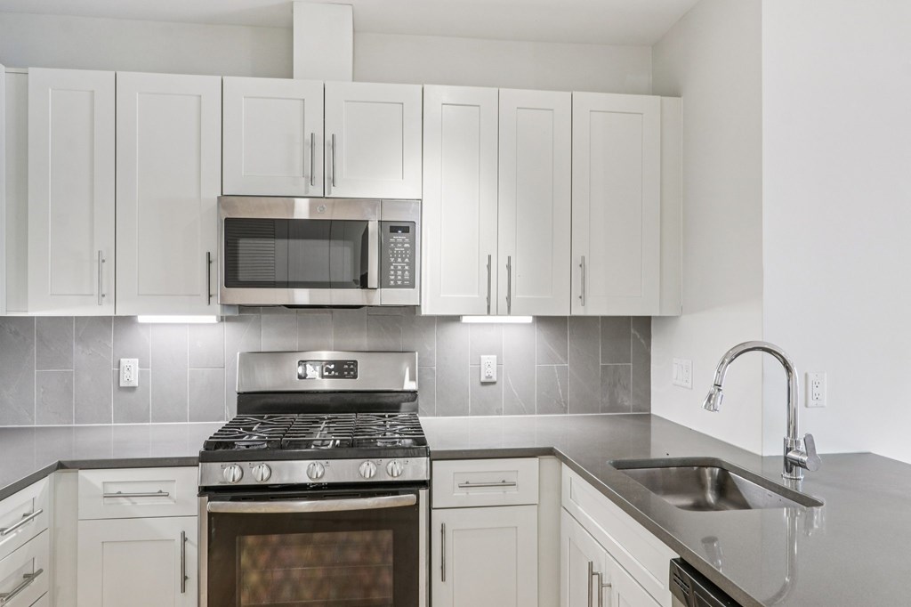 Kitchen with granite countertop and sink at Park77 Apartments, Cambridge, MA