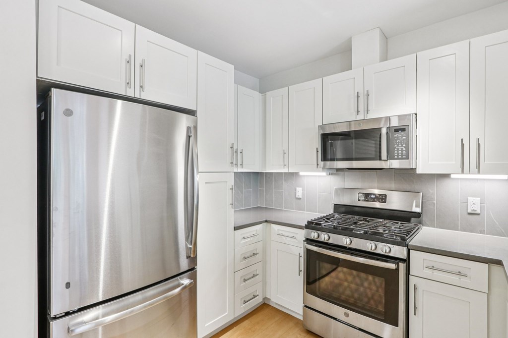 Kitchen with white cabinetry at Park77 Apartments, Massachusetts, 02138