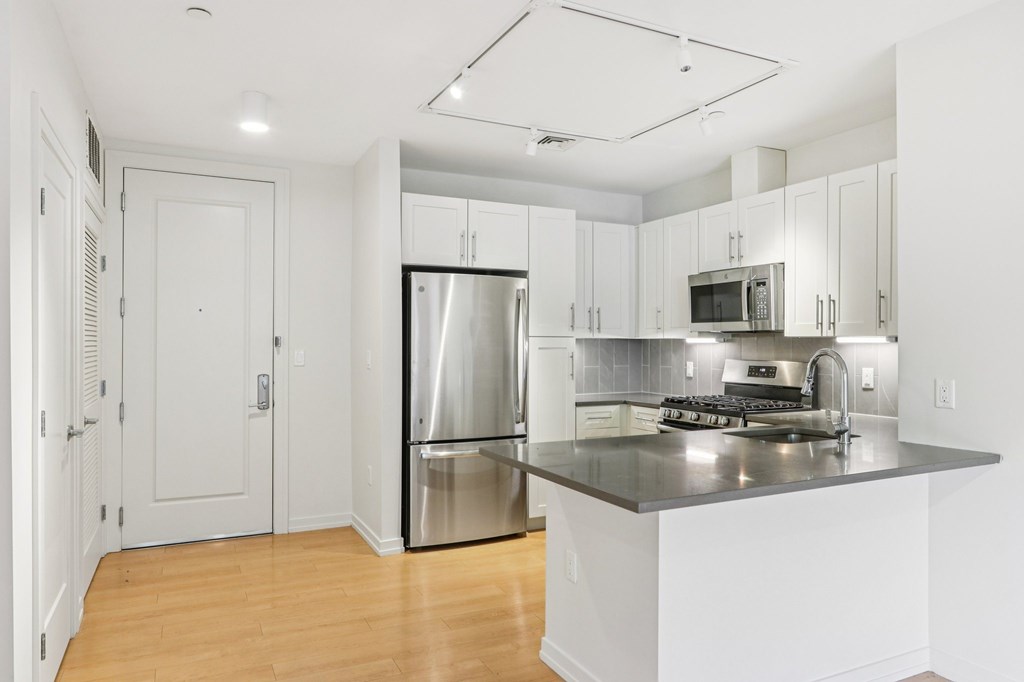 Kitchen with Modern appliances at Park77 Apartments, Cambridge
