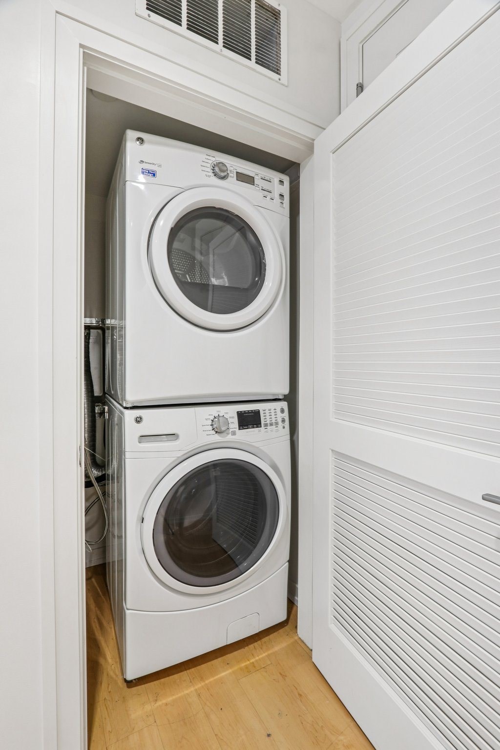 Front loading machines in small laundry room at Park77 Apartments, Massachusetts